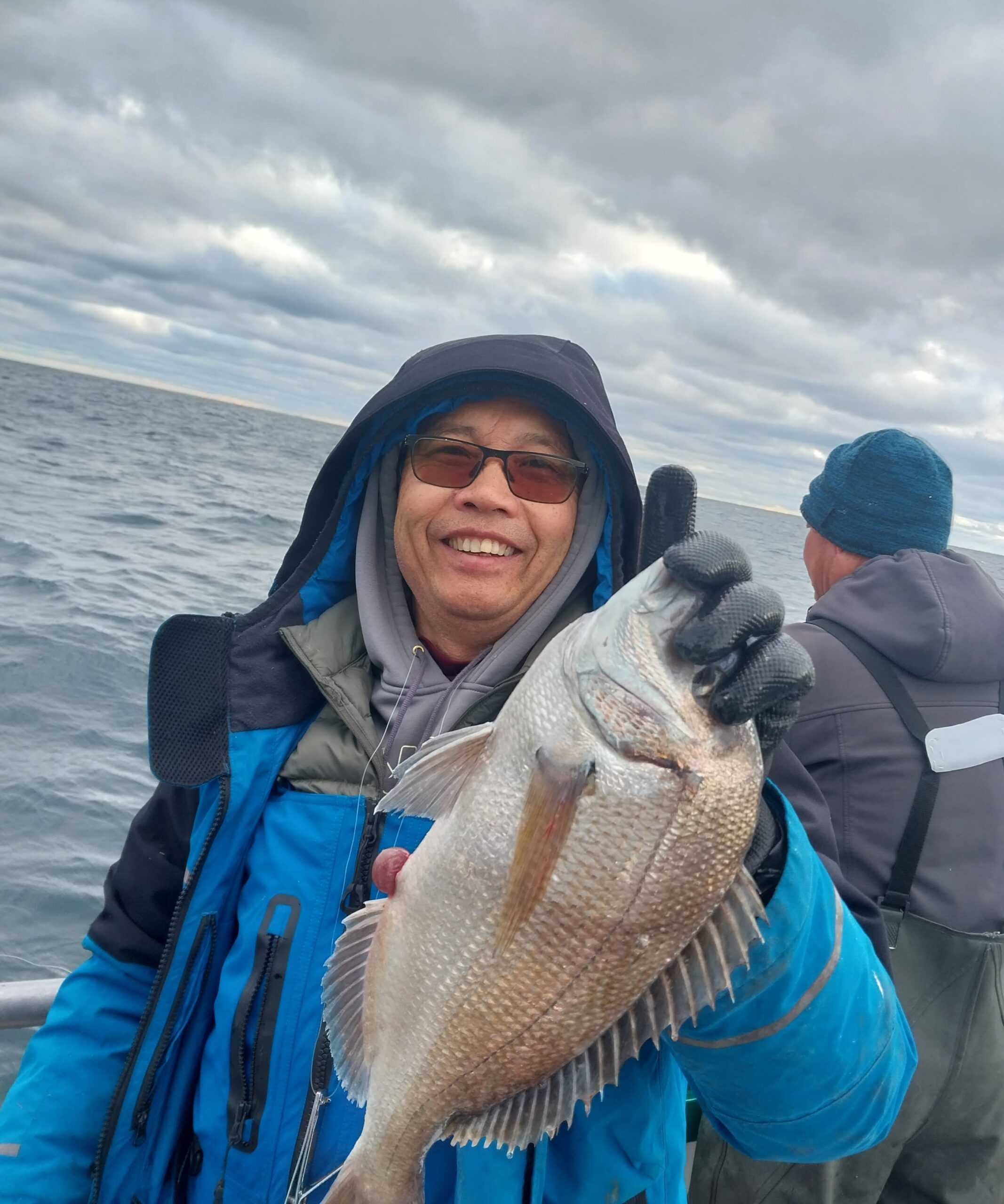 a person standing next to a body of water