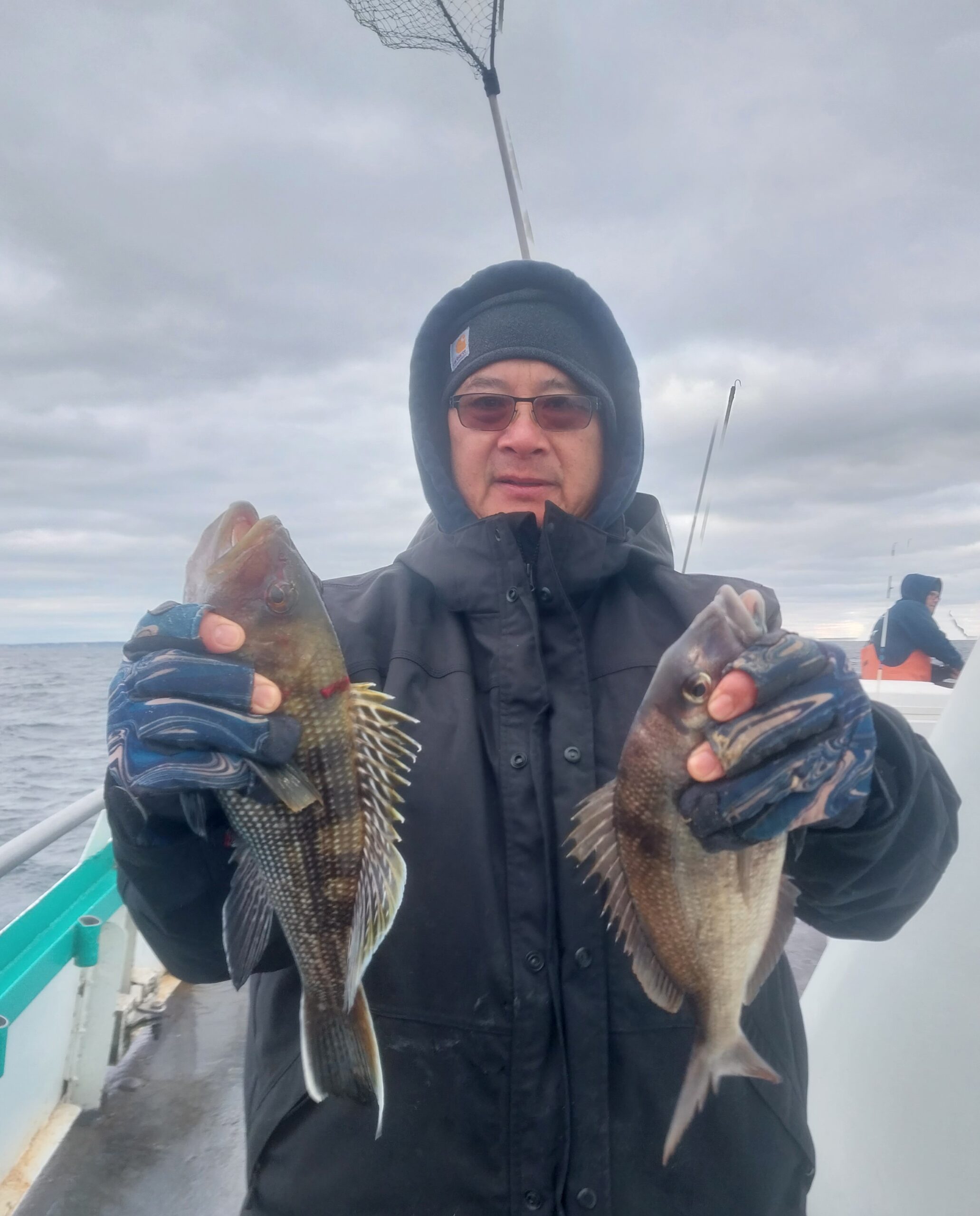 a person holding a fish