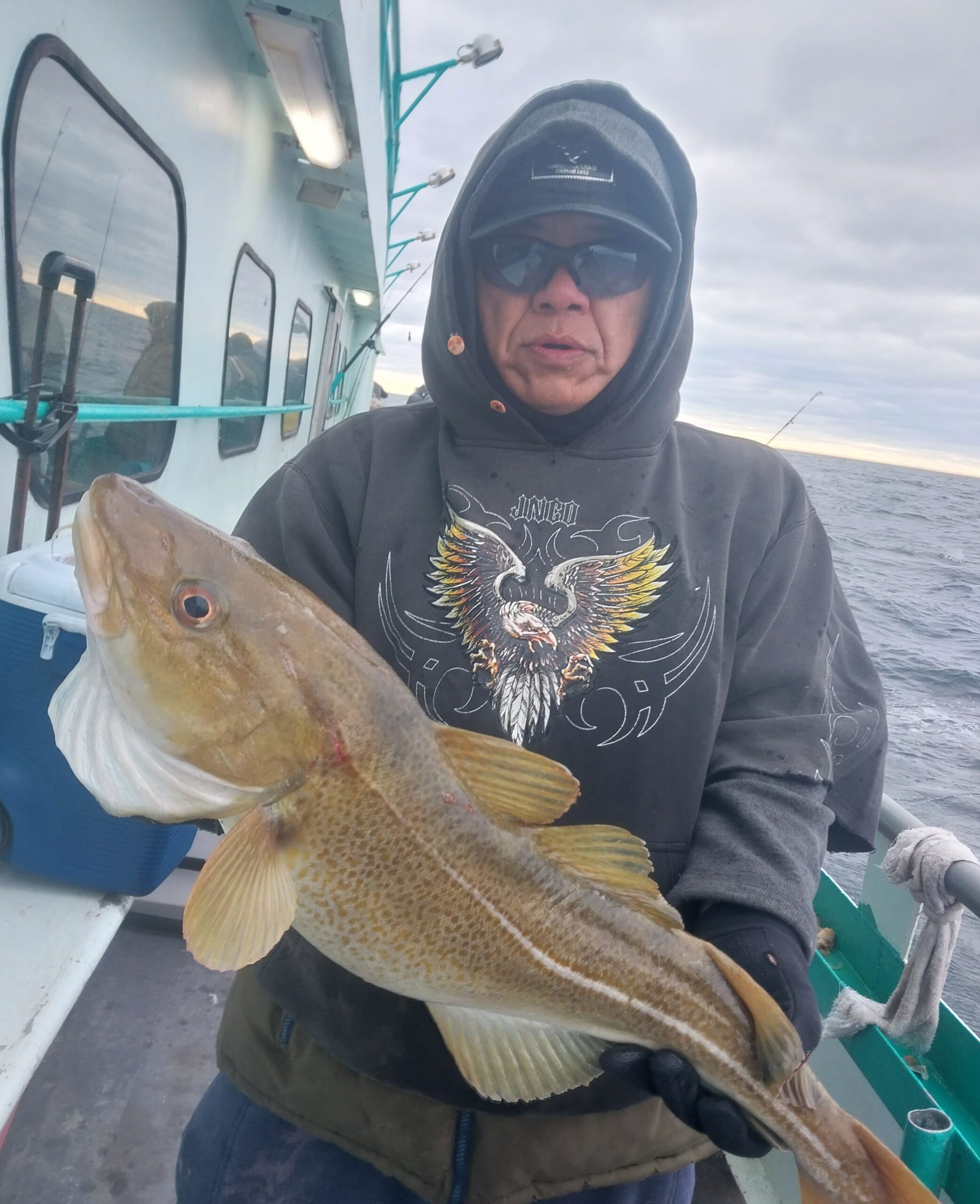 a man holding a fish