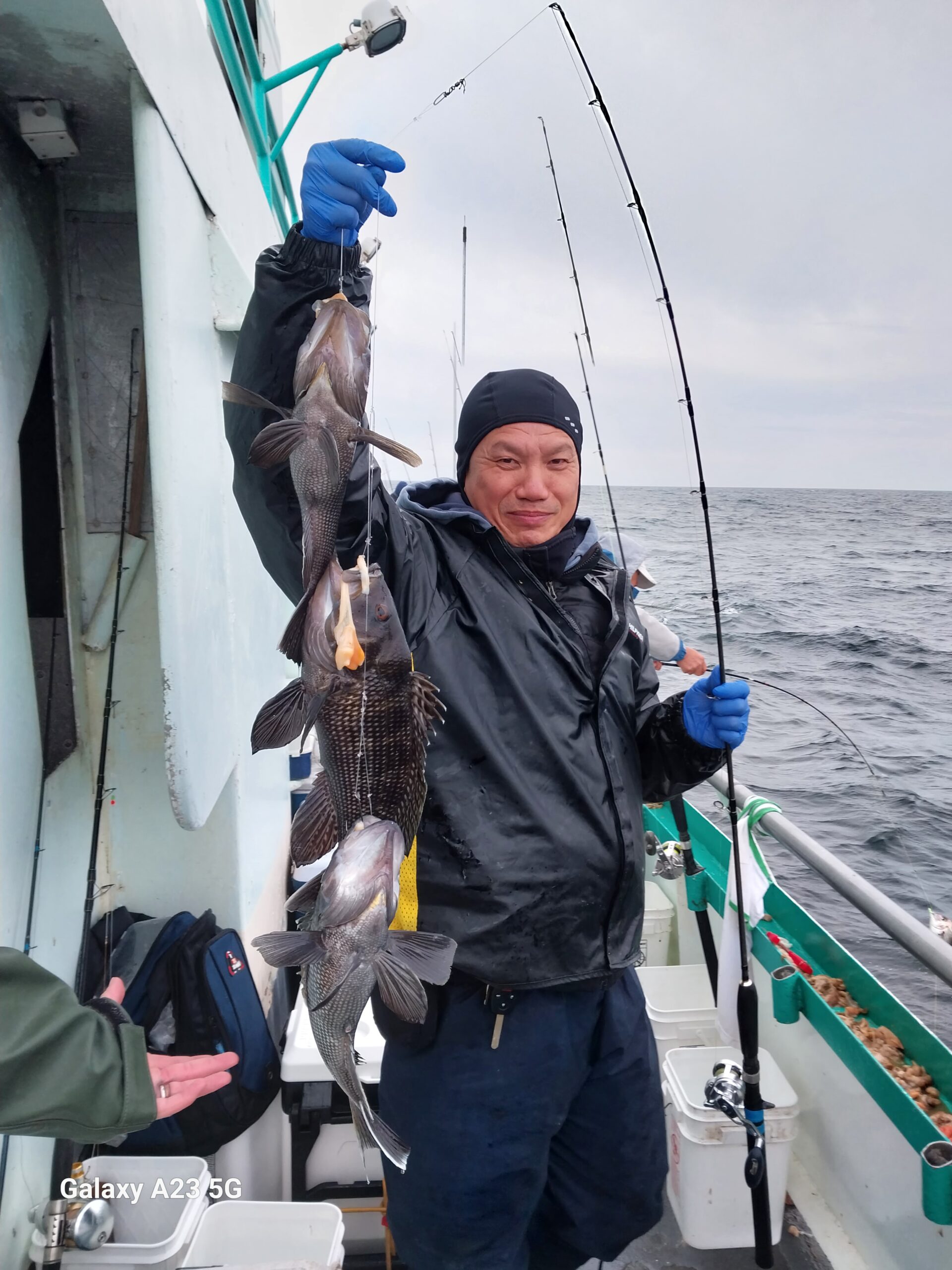 a couple of people that are standing in the water