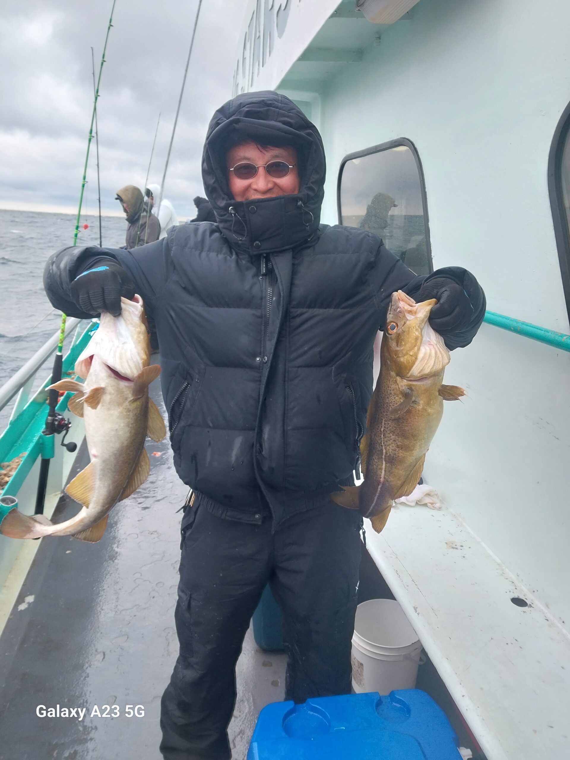 a person holding a fish