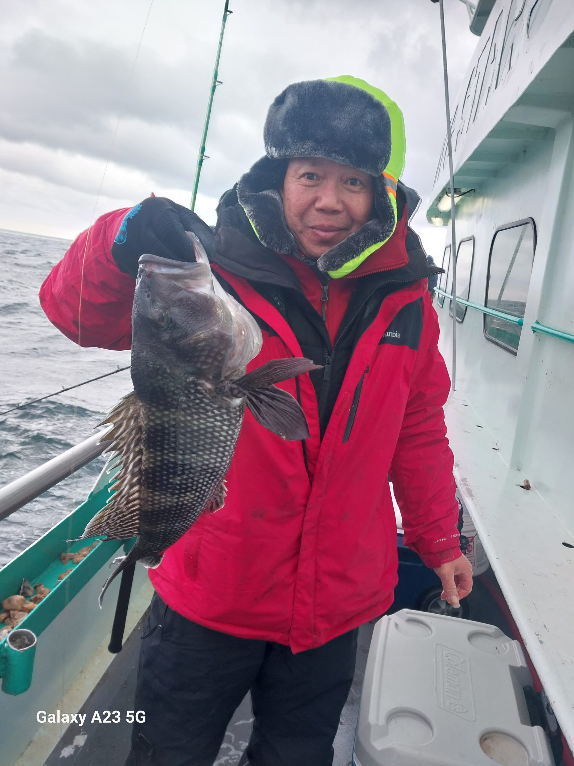 a little boy that is standing in the snow