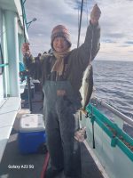 a person holding a fish