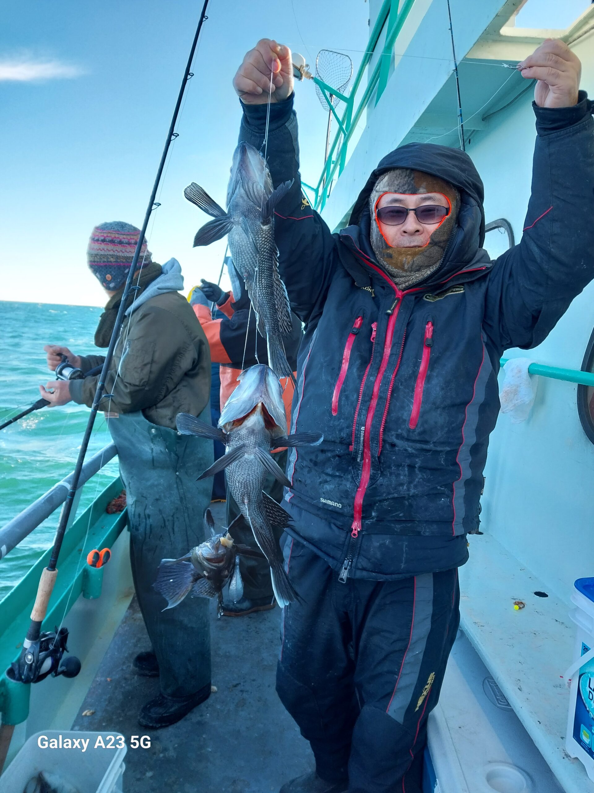 a couple of people that are standing in the snow
