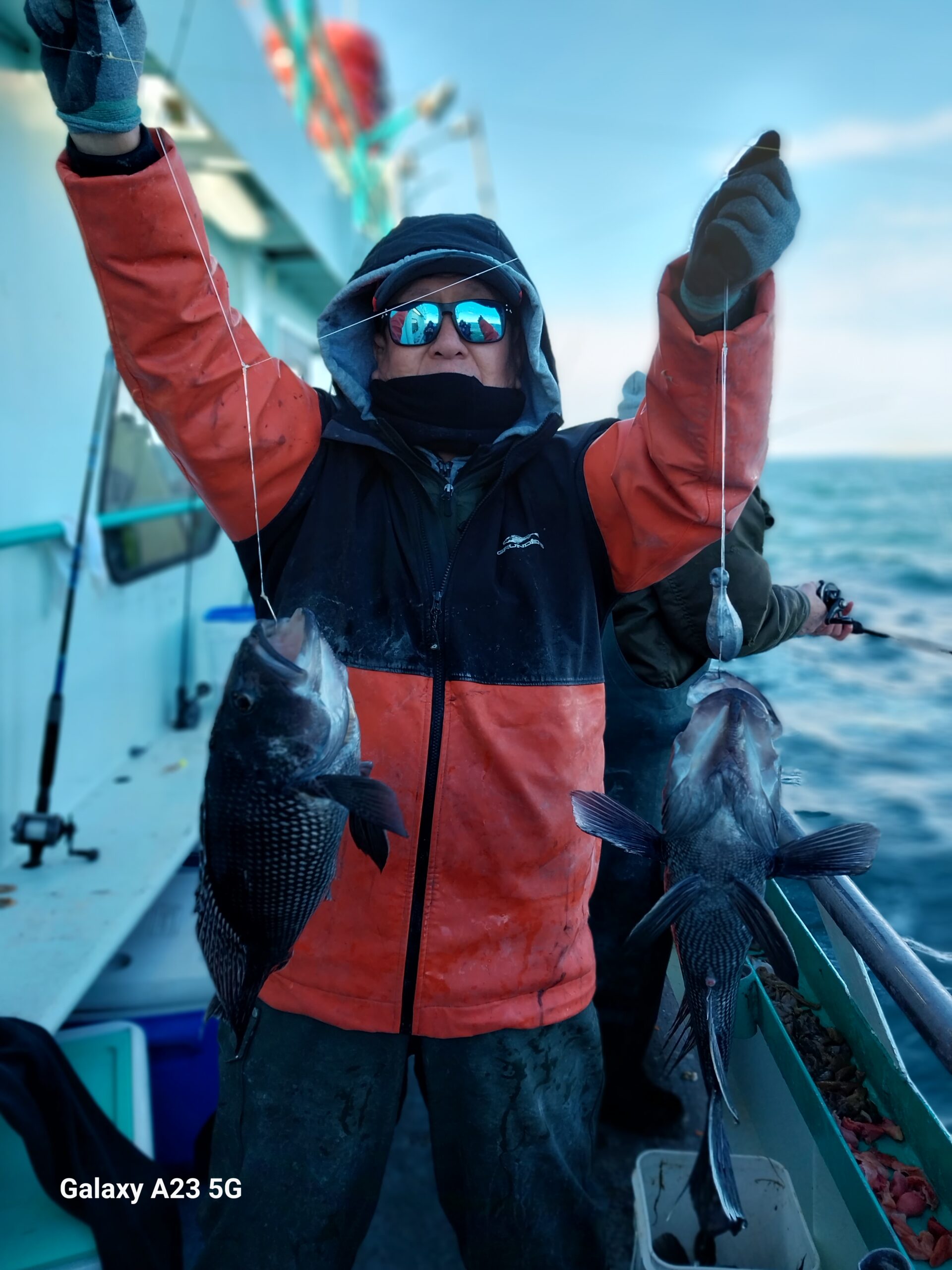 a person holding a fish