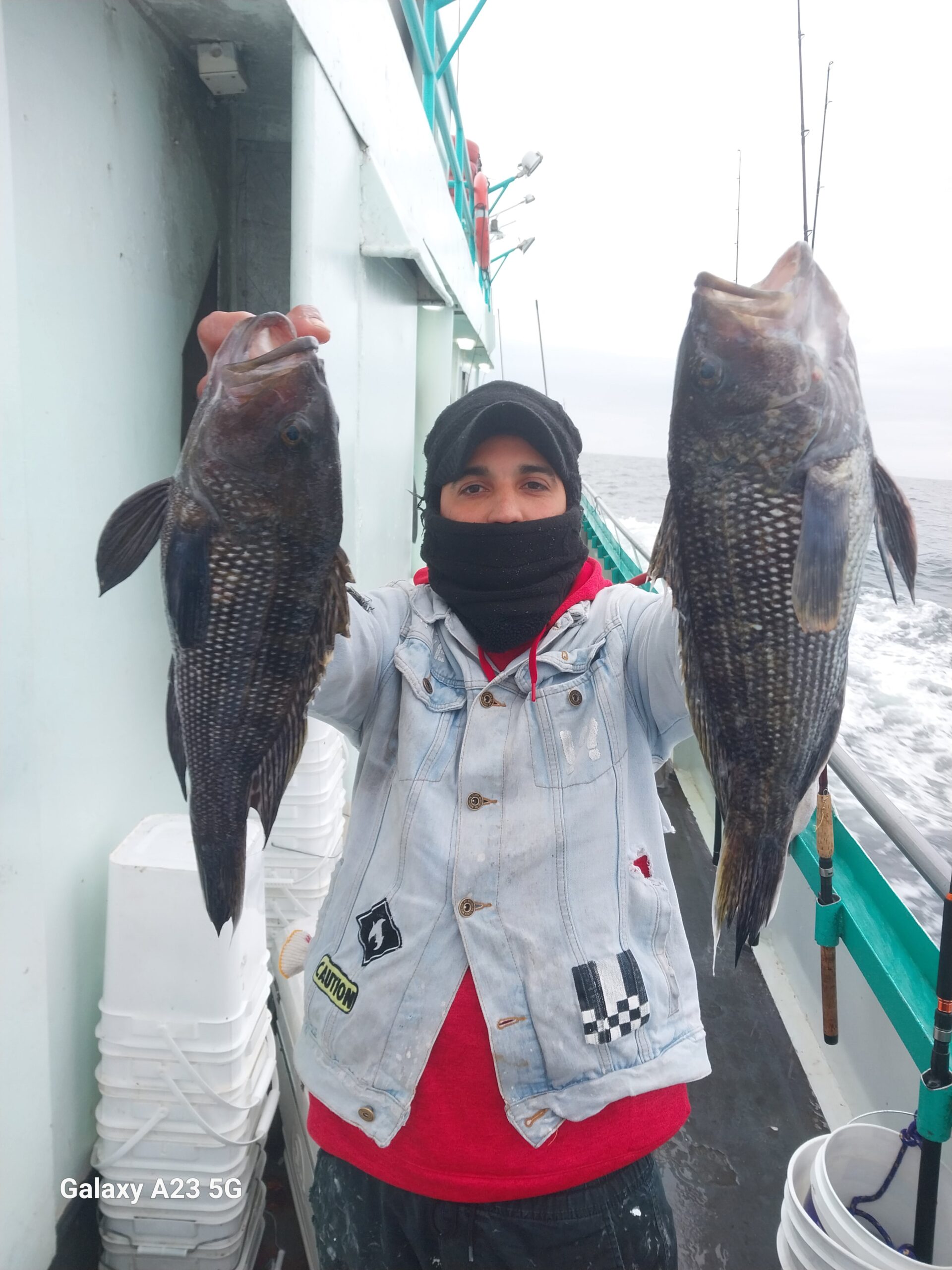 a person holding a fish