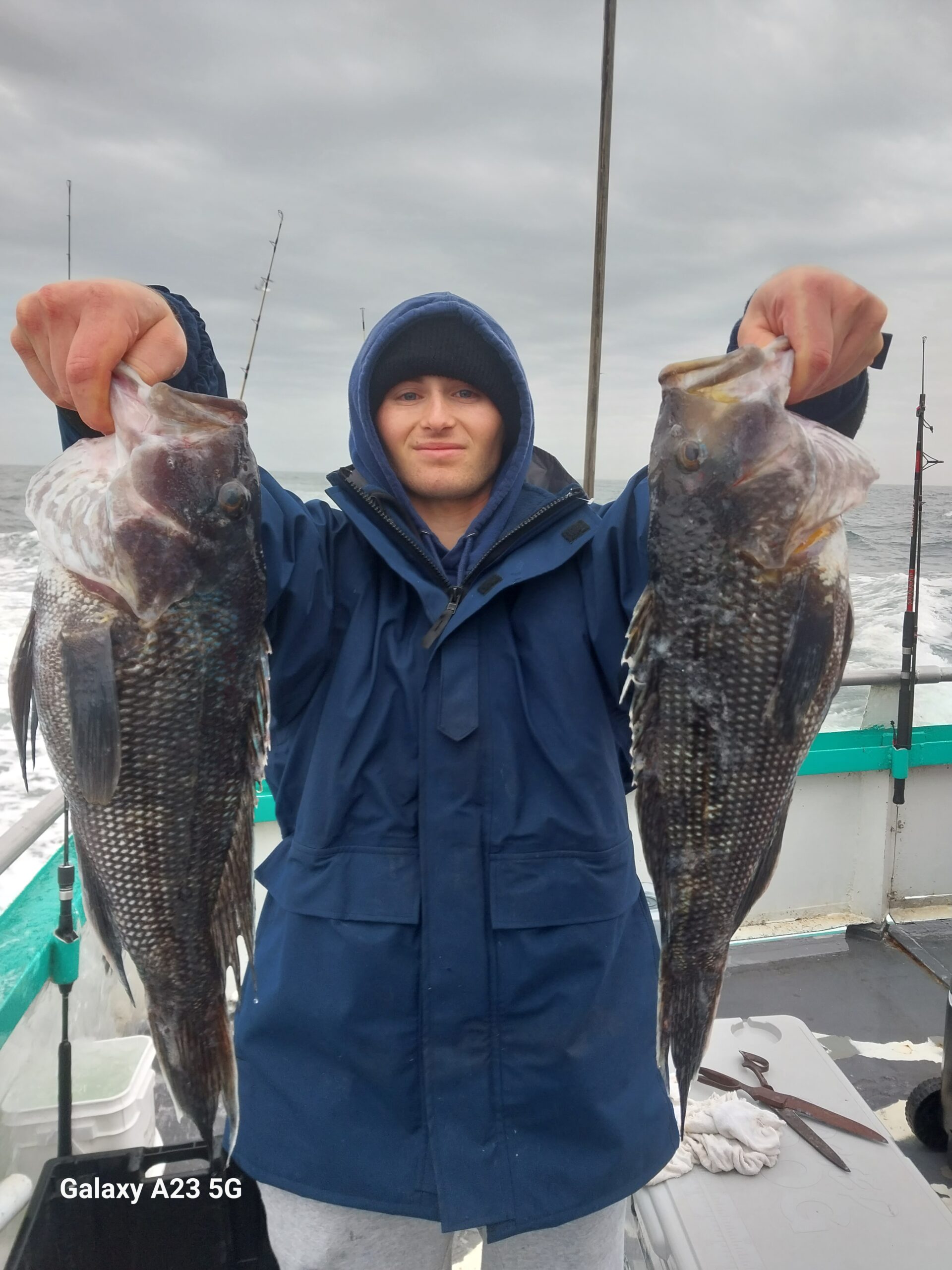 a person holding a fish