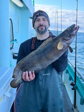 a person holding a fish