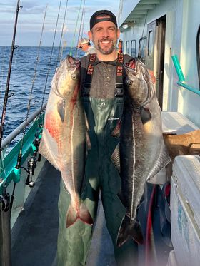 a person holding a fish