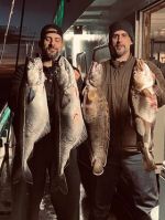 a man holding a fish