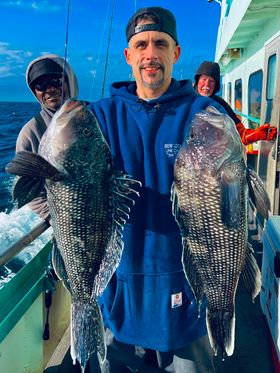a man holding a fish