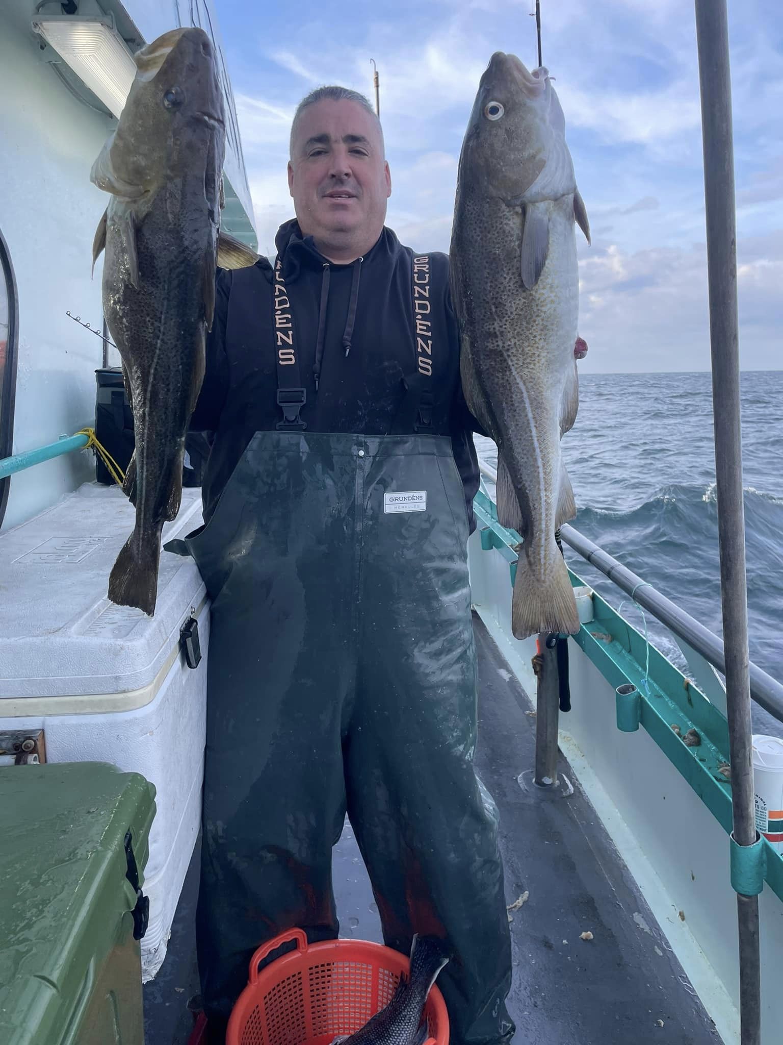 a person holding a fish