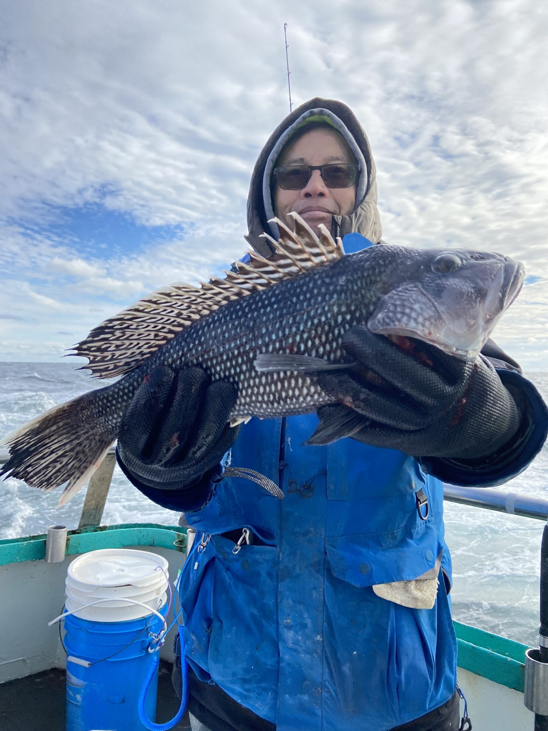 a person holding a fish