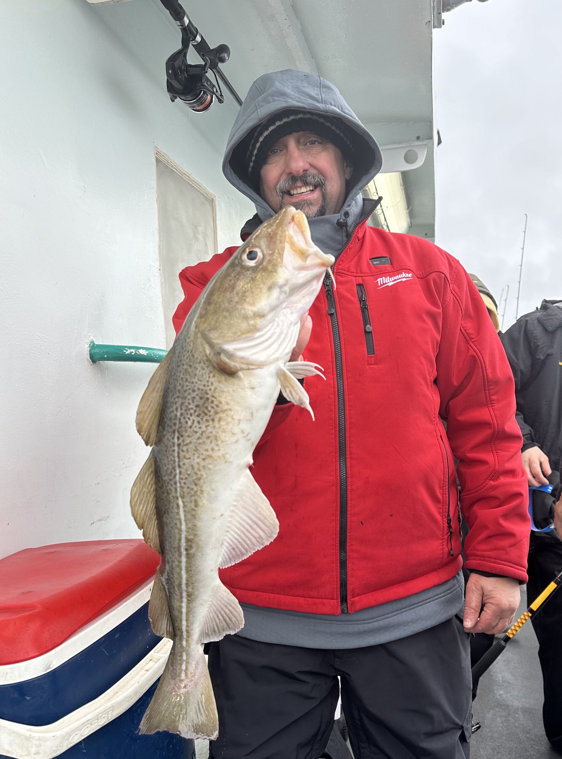 a person holding a fish