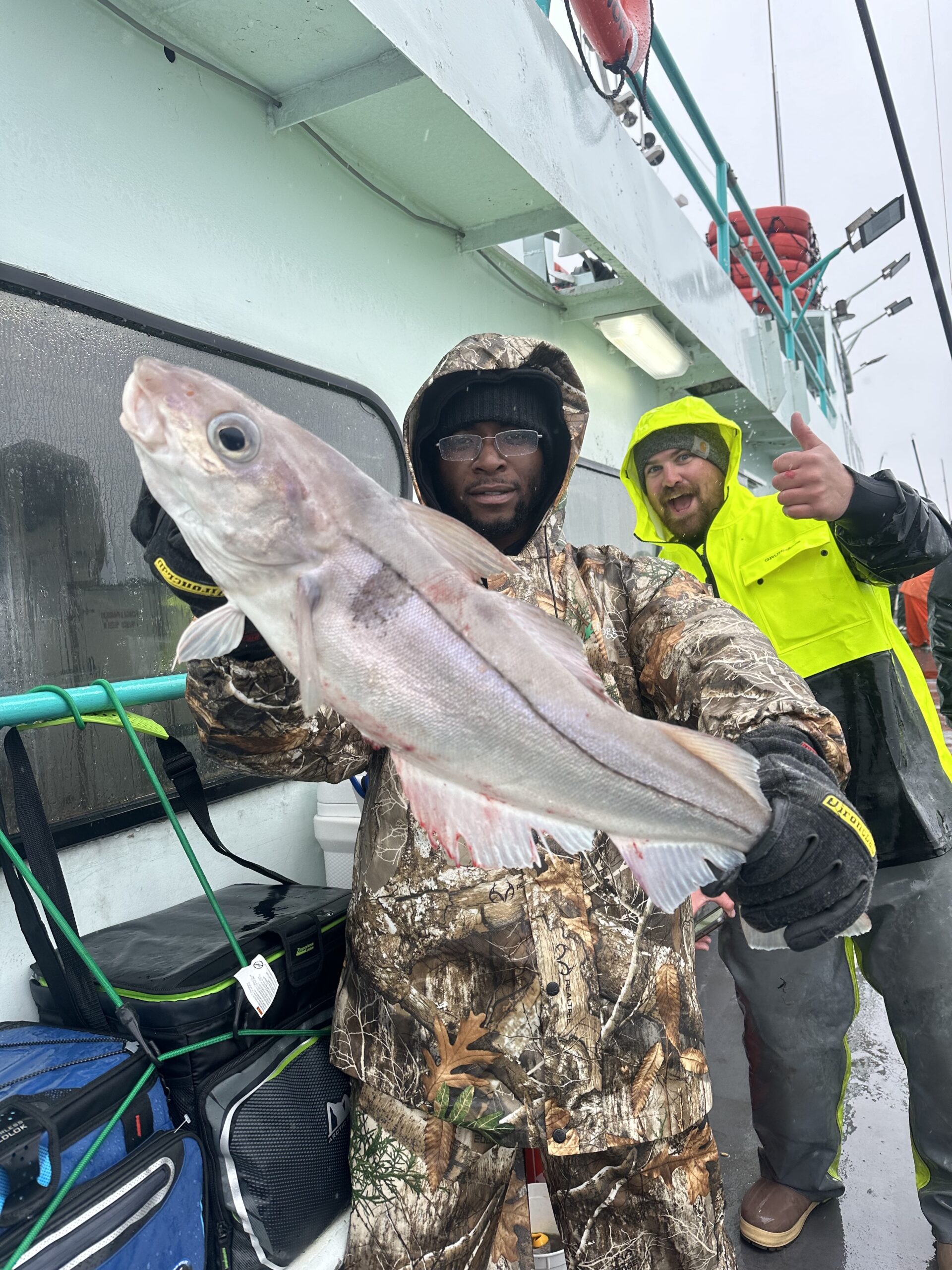 a person holding a fish
