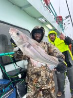 a person holding a fish