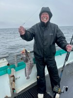 a person holding a kite in a boat on the water