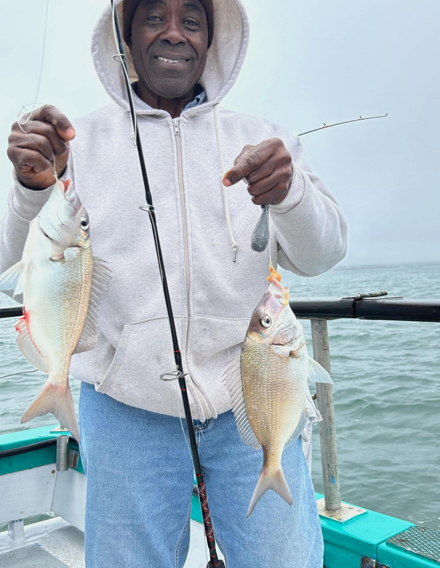 a person holding a fish in the water
