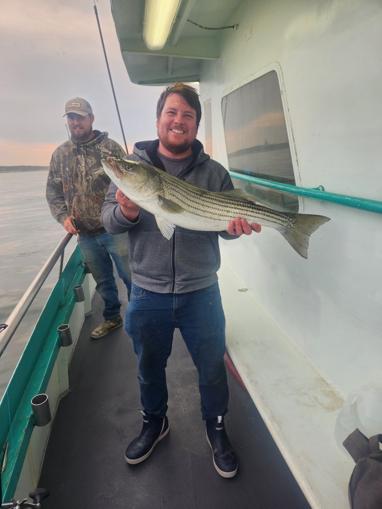 a man holding a fish