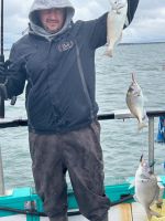 a person standing next to a body of water