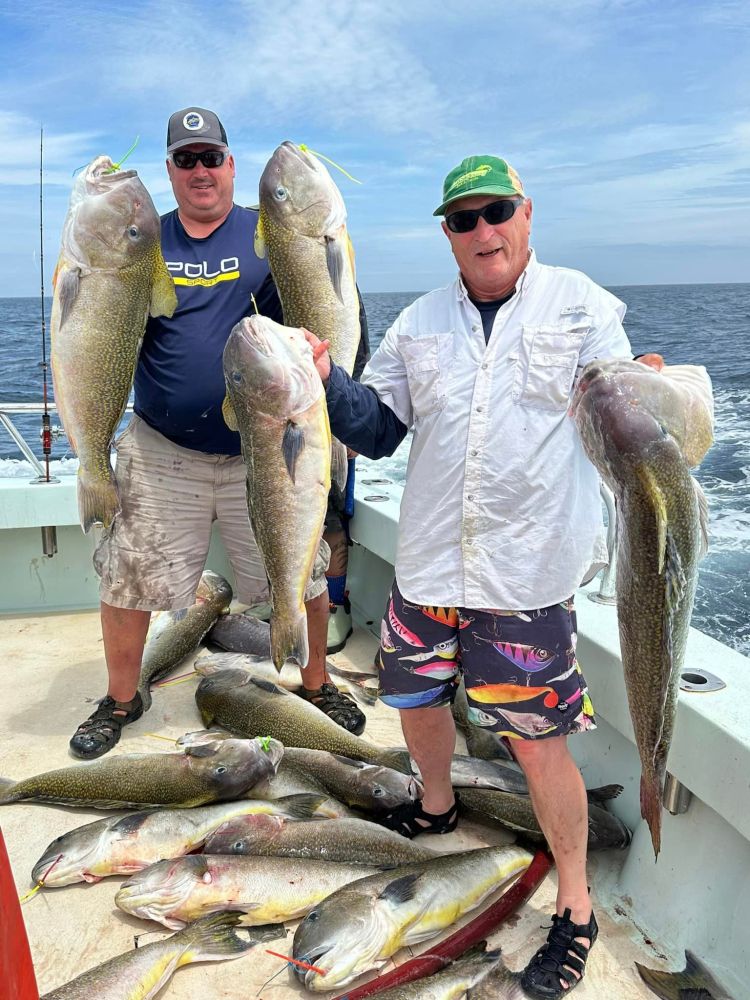 a man holding a fish