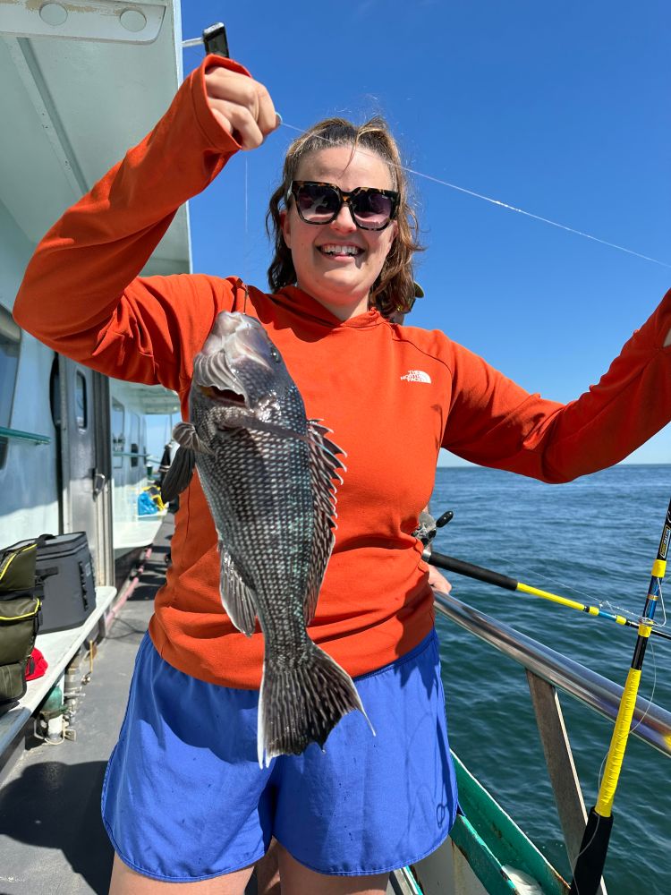 a person holding a fish