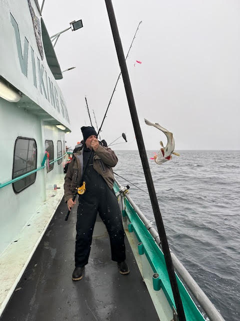 a group of people on a boat in the water