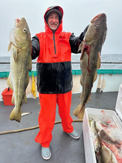 a person holding a fish