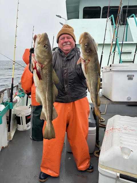 a person holding a fish