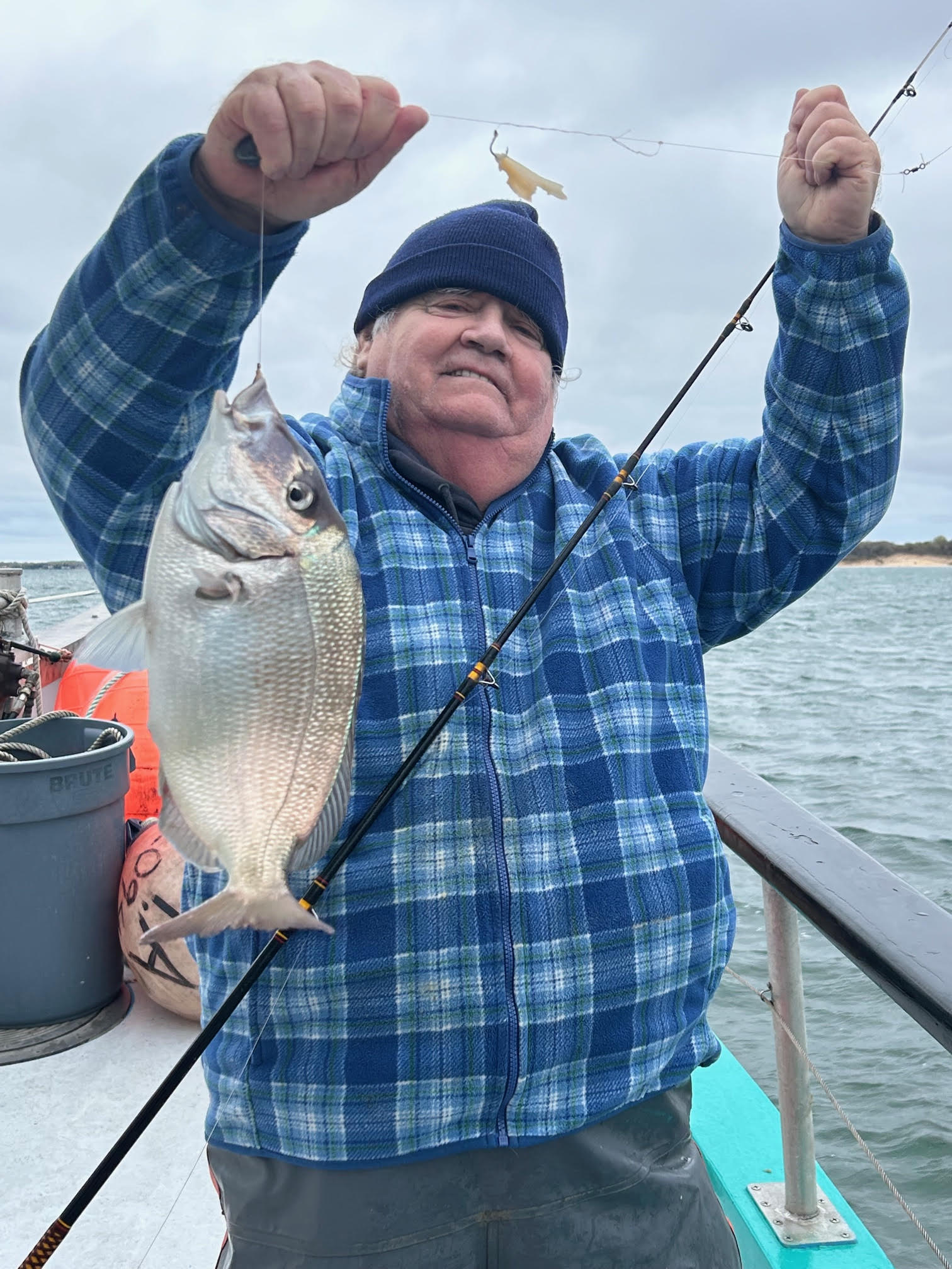 a man holding a fish
