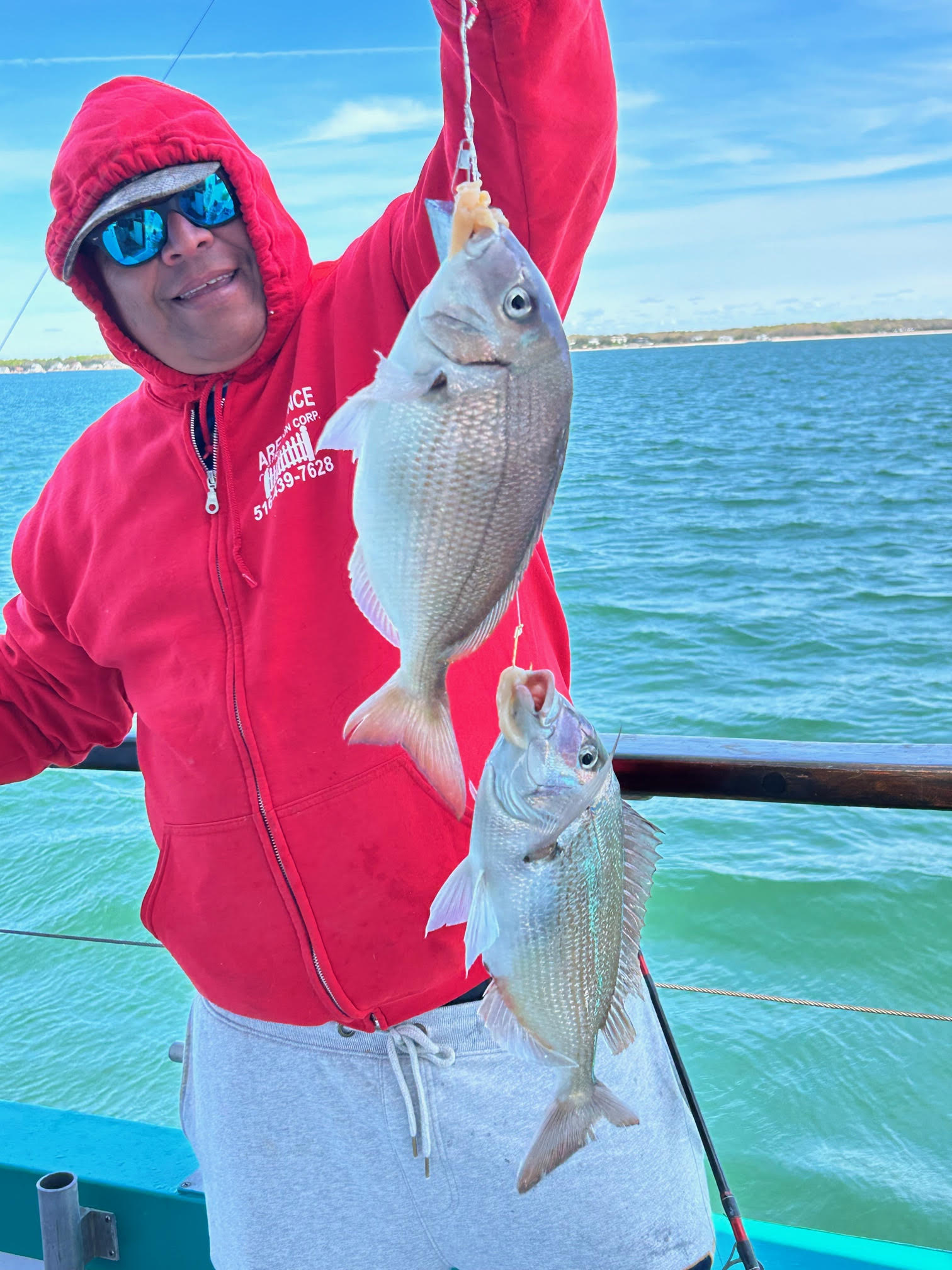a person holding a fish in the water