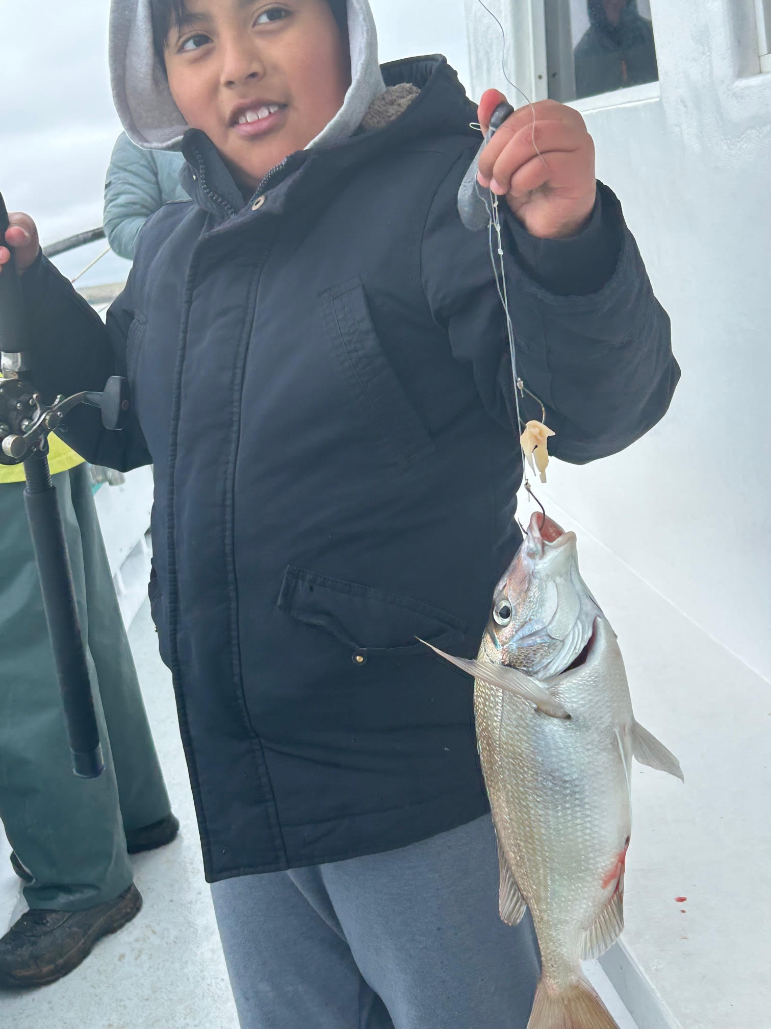 a person holding a fish