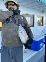 a person wearing a blue uniform holding a gun