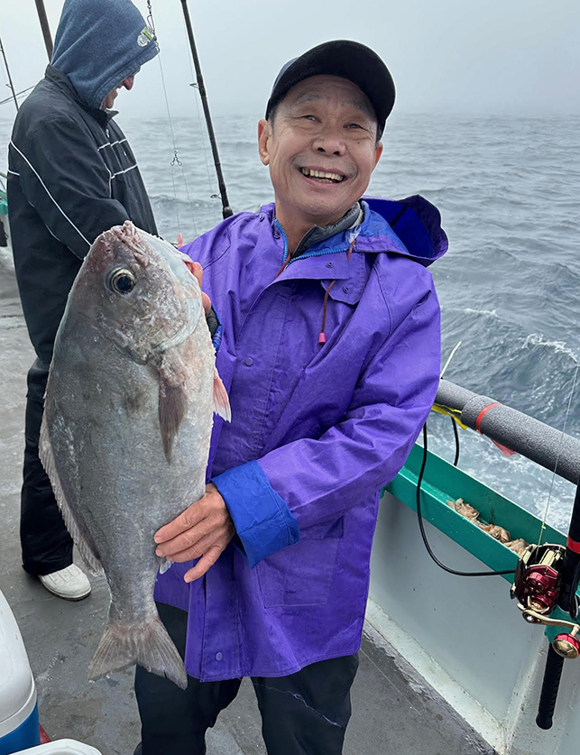 a person holding a fish