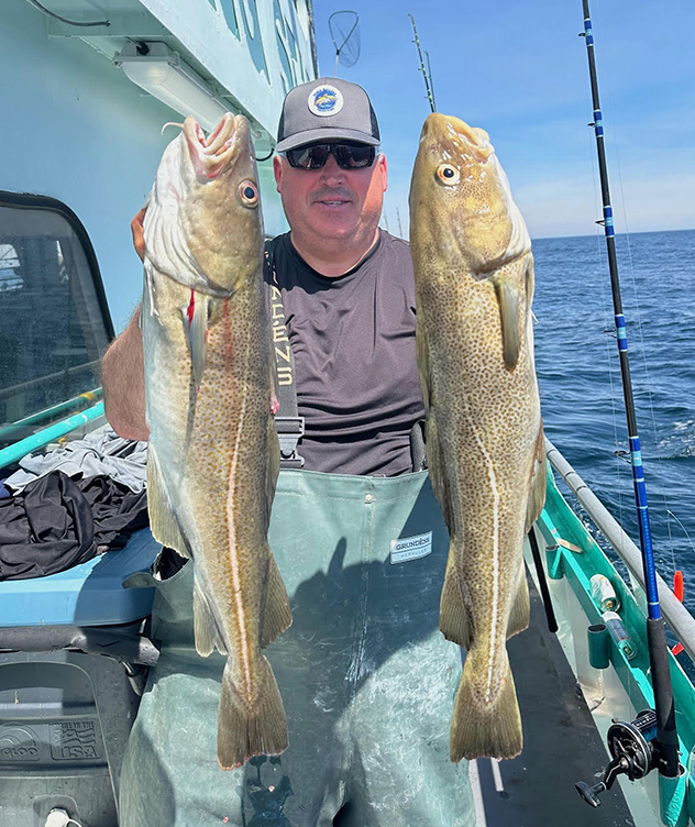 a person holding a fish