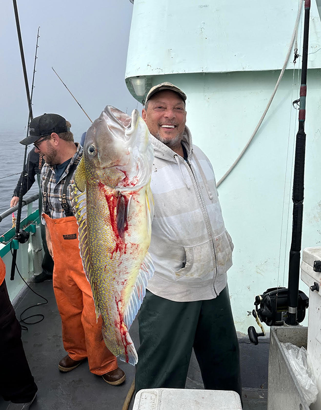 a person holding a fish