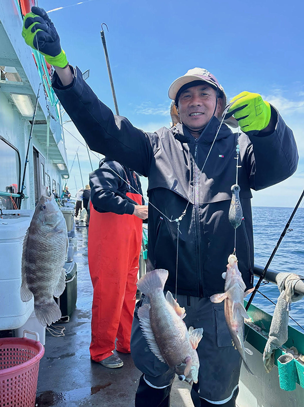 a man holding a fish