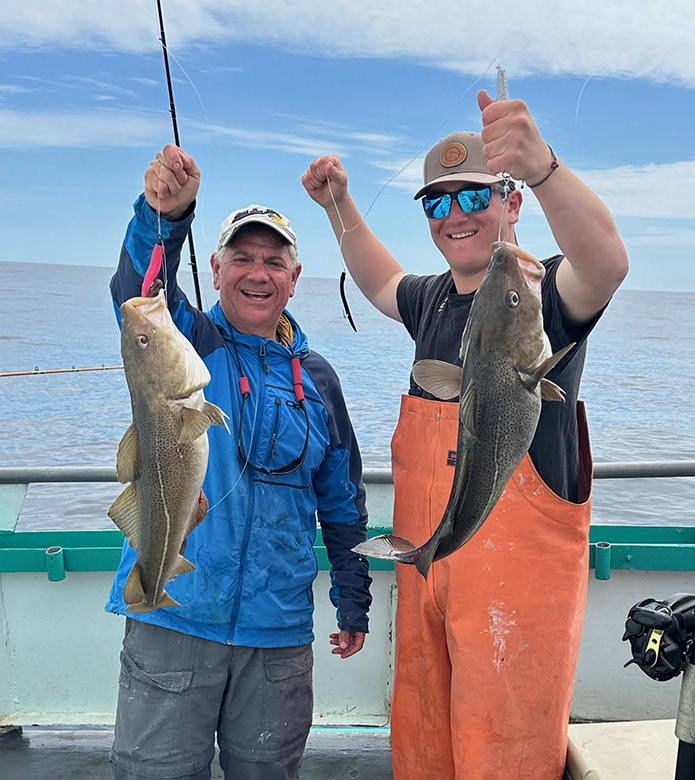 a person holding a fish in the water