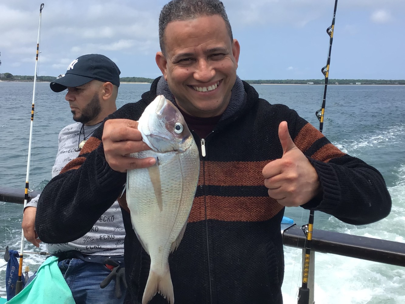 a person holding a fish in the water