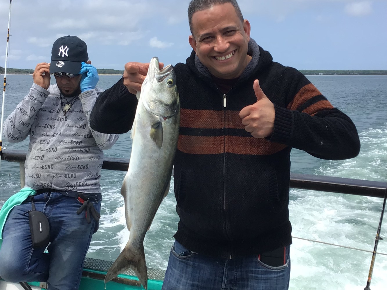 a person holding a fish in the water