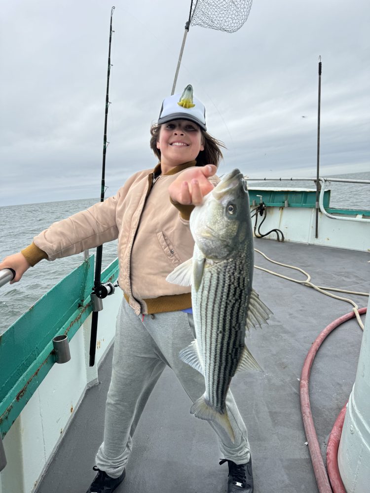 a person holding a fish