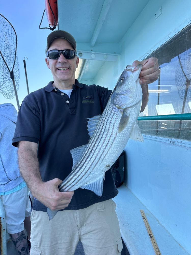 a man holding a fish