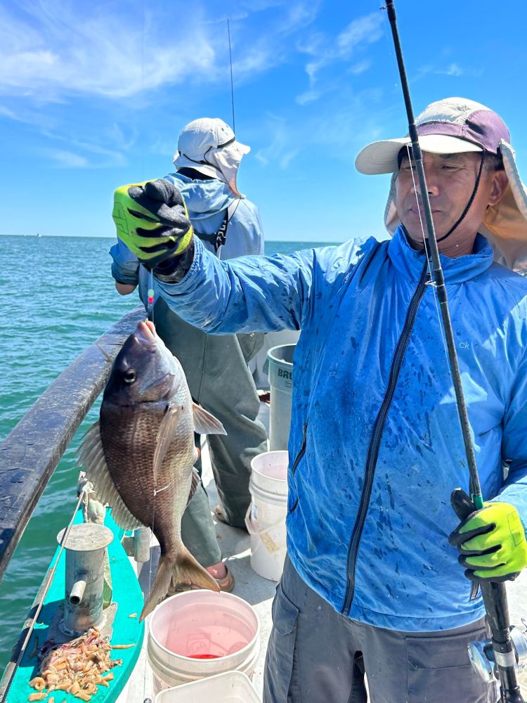 a person holding a fish