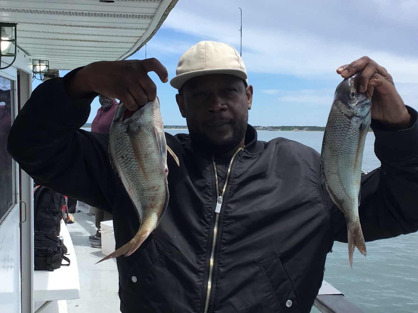 a man holding a fish