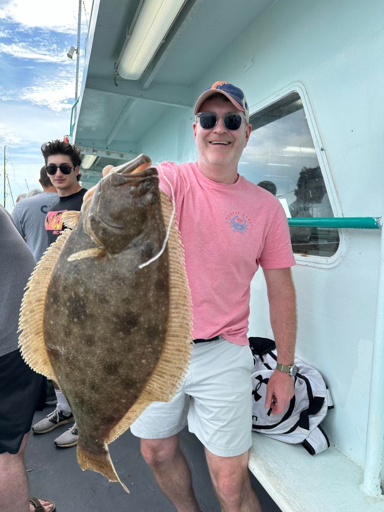 a man holding a fish