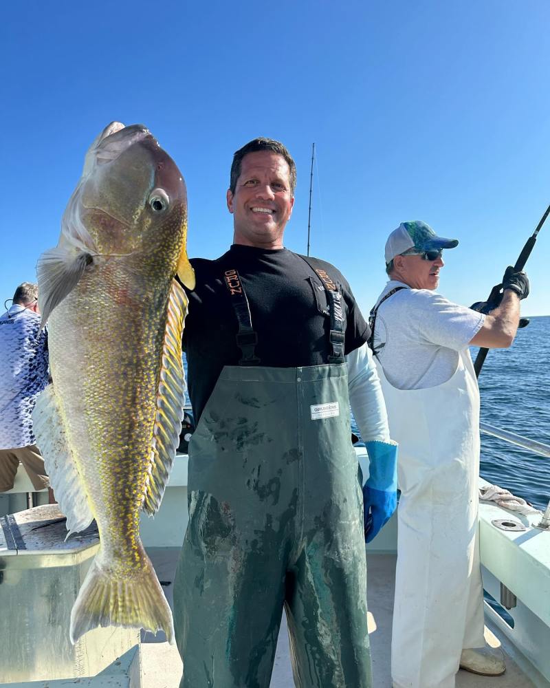 a person holding a fish