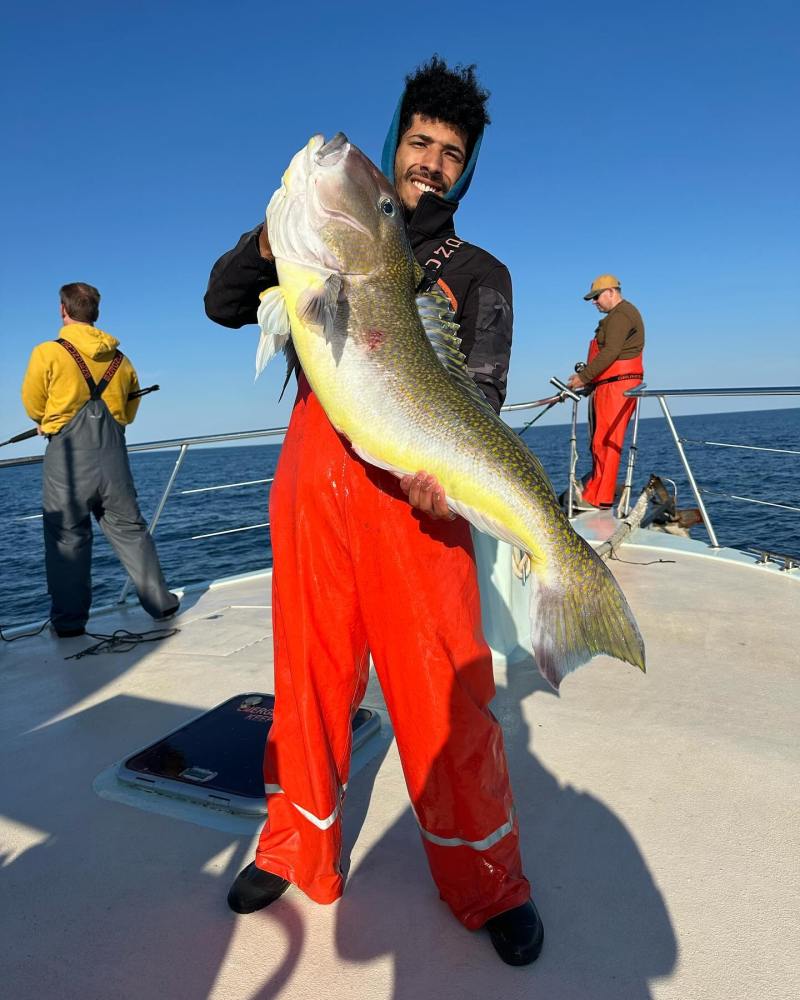 Muhammad Adil holding a fish