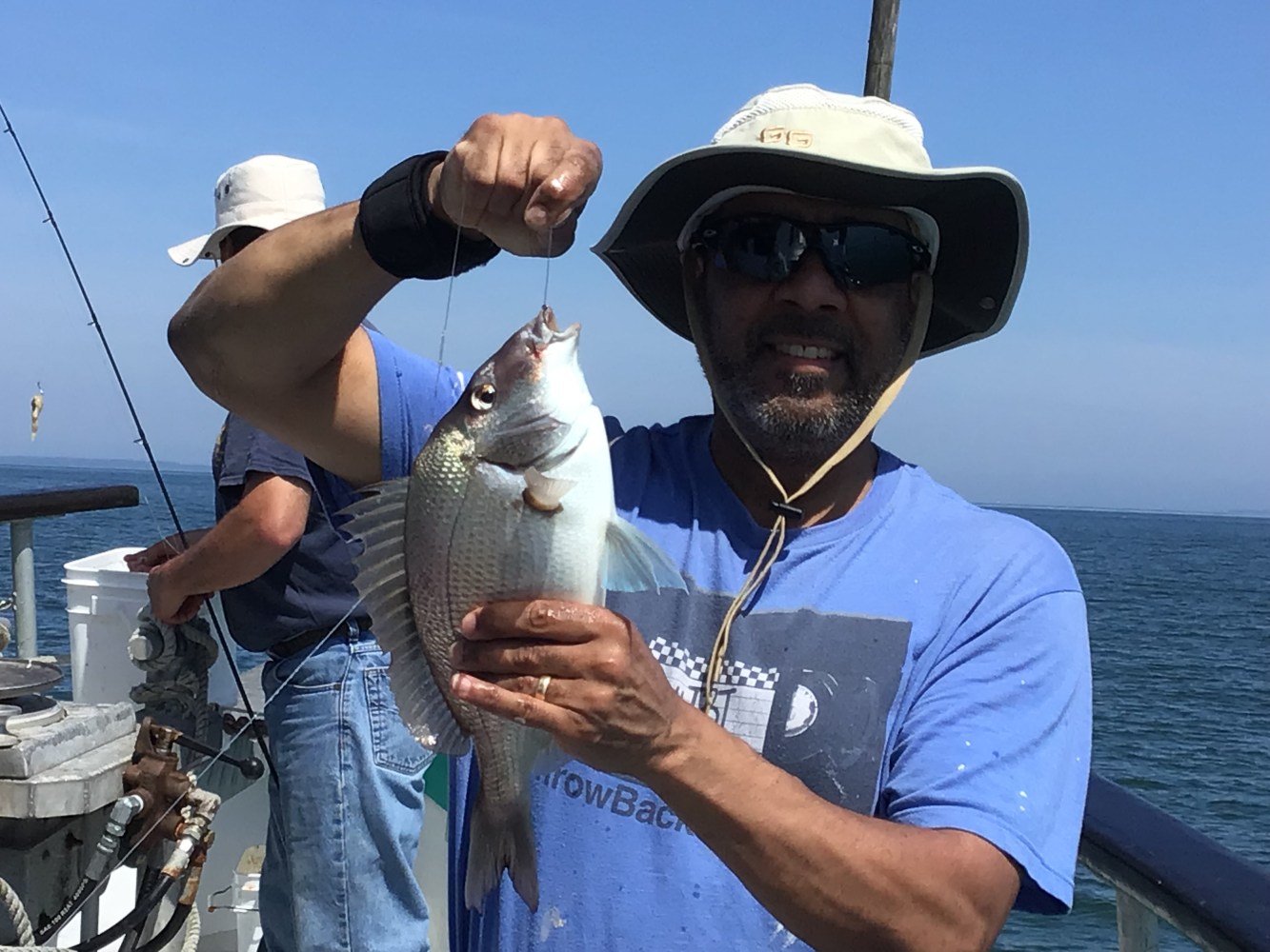 a person holding a fish