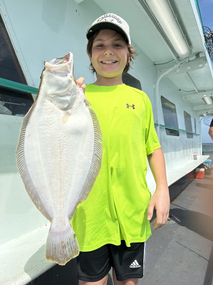 a person holding a fish