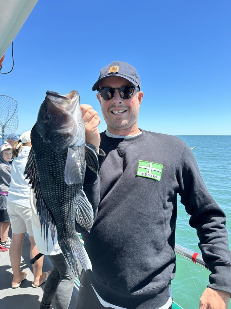 a man holding a fish